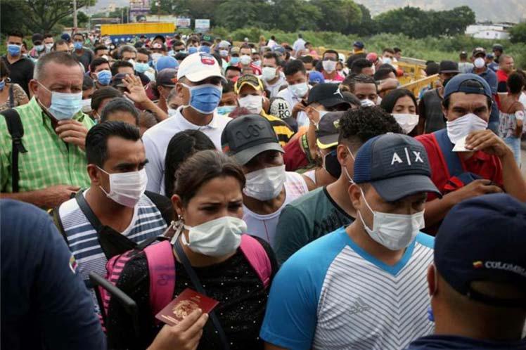 Tausende Menschen versuchen in ihr Heimatland Venezuela zurückzukehren